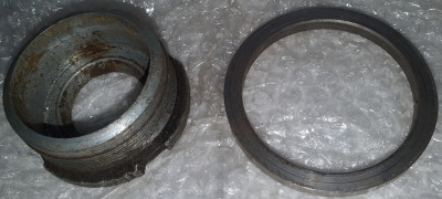 Shock tube nut and bottom centering ring.jpg and 